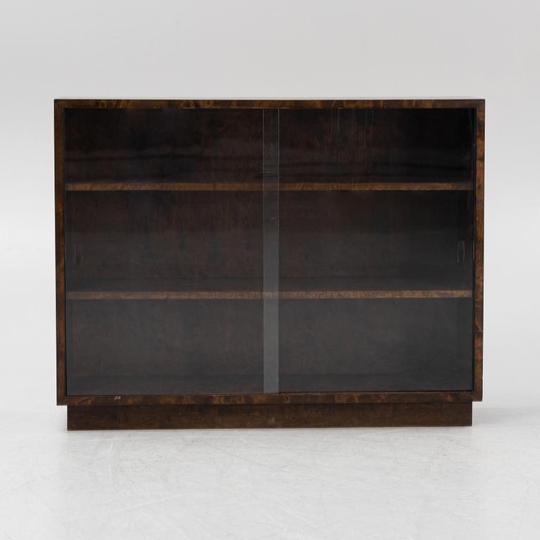 A birch book case with glass sliding doors, first part of the 20th Century.