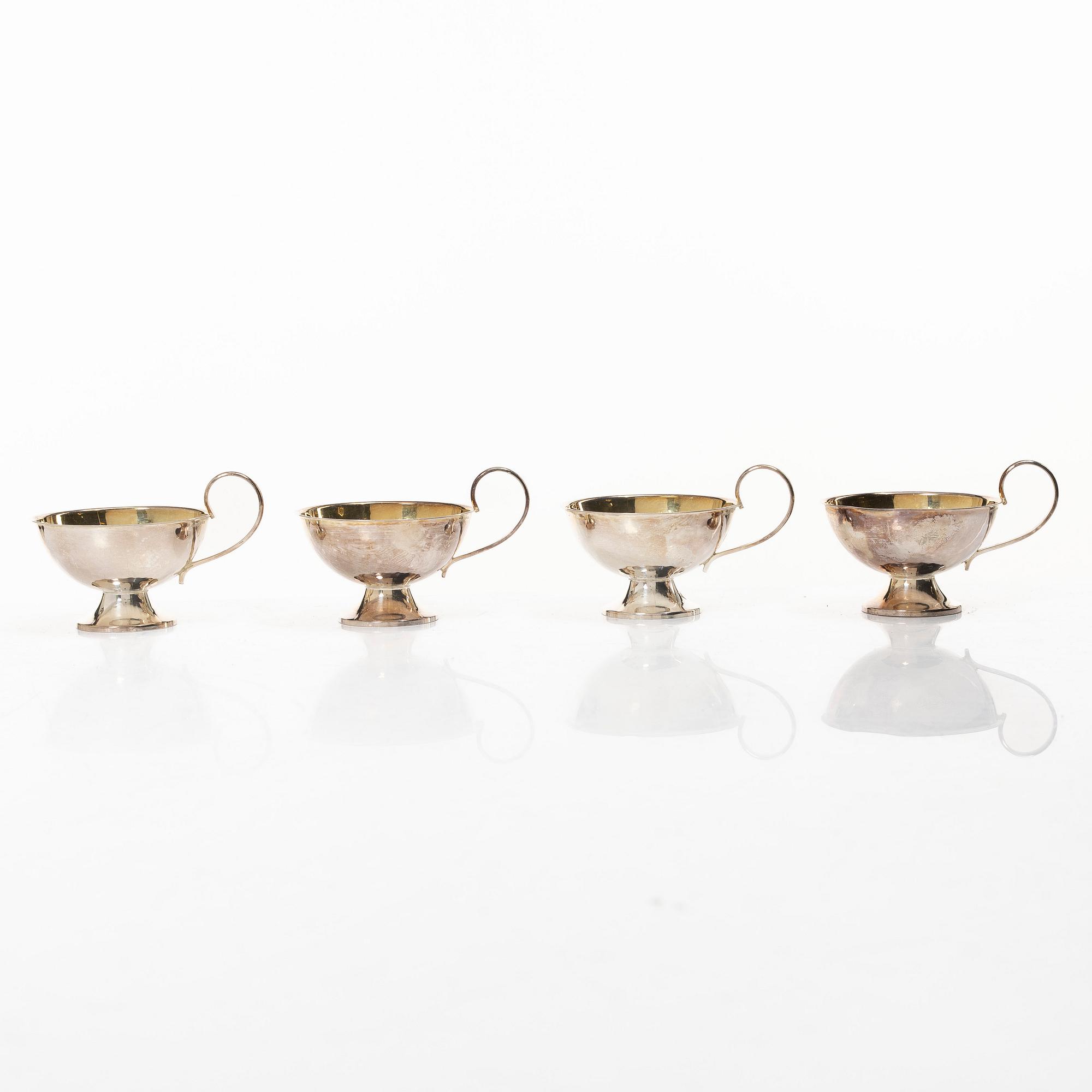 Sauceboat and four punch cups, silver, Sweden, 20th century.