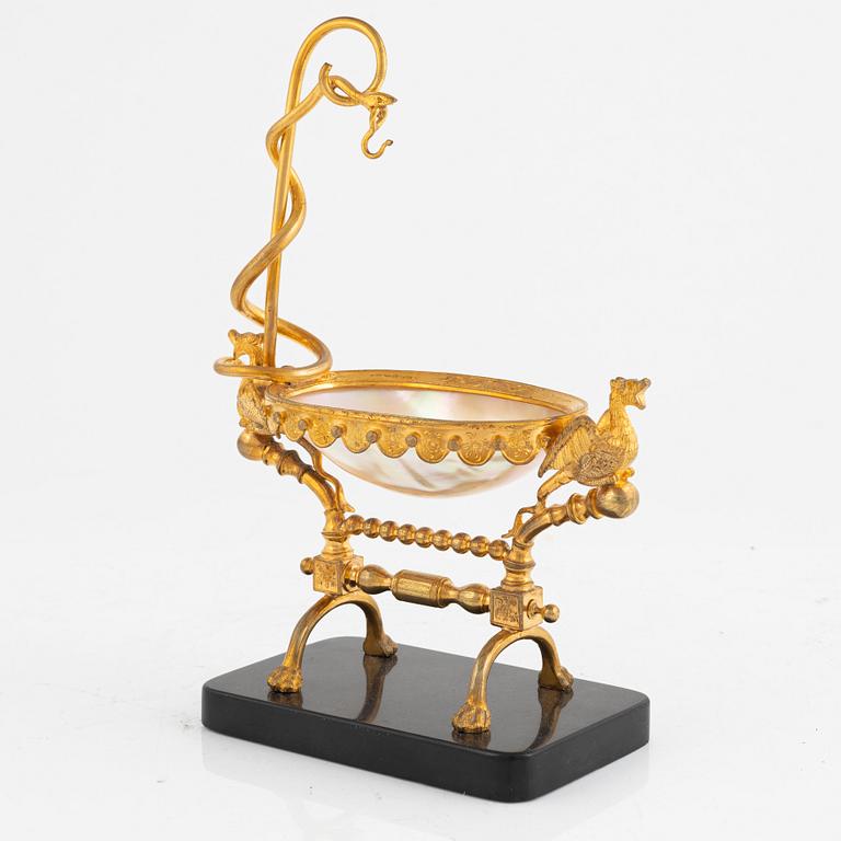 A gilt-brass, mother of pearl and diabase pocket-watch stand, late 19th century.