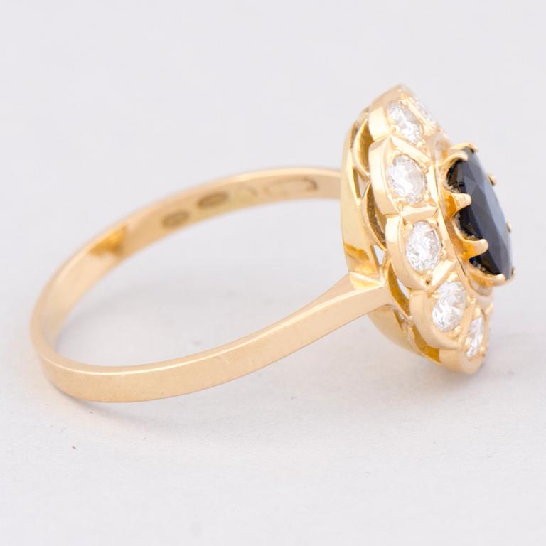 A RING, facetted sapphire, brilliant cut diamonds, 18K gold. Meidän sepät, Espoo Finland 1991.