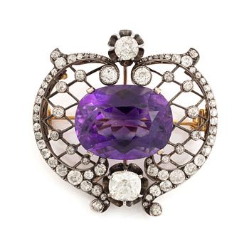 A brooch set with an amethyst and old-cut diamonds.