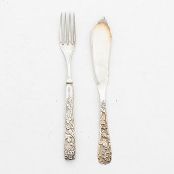 A set of 28 silver sandwich cutlery, cira 1900.