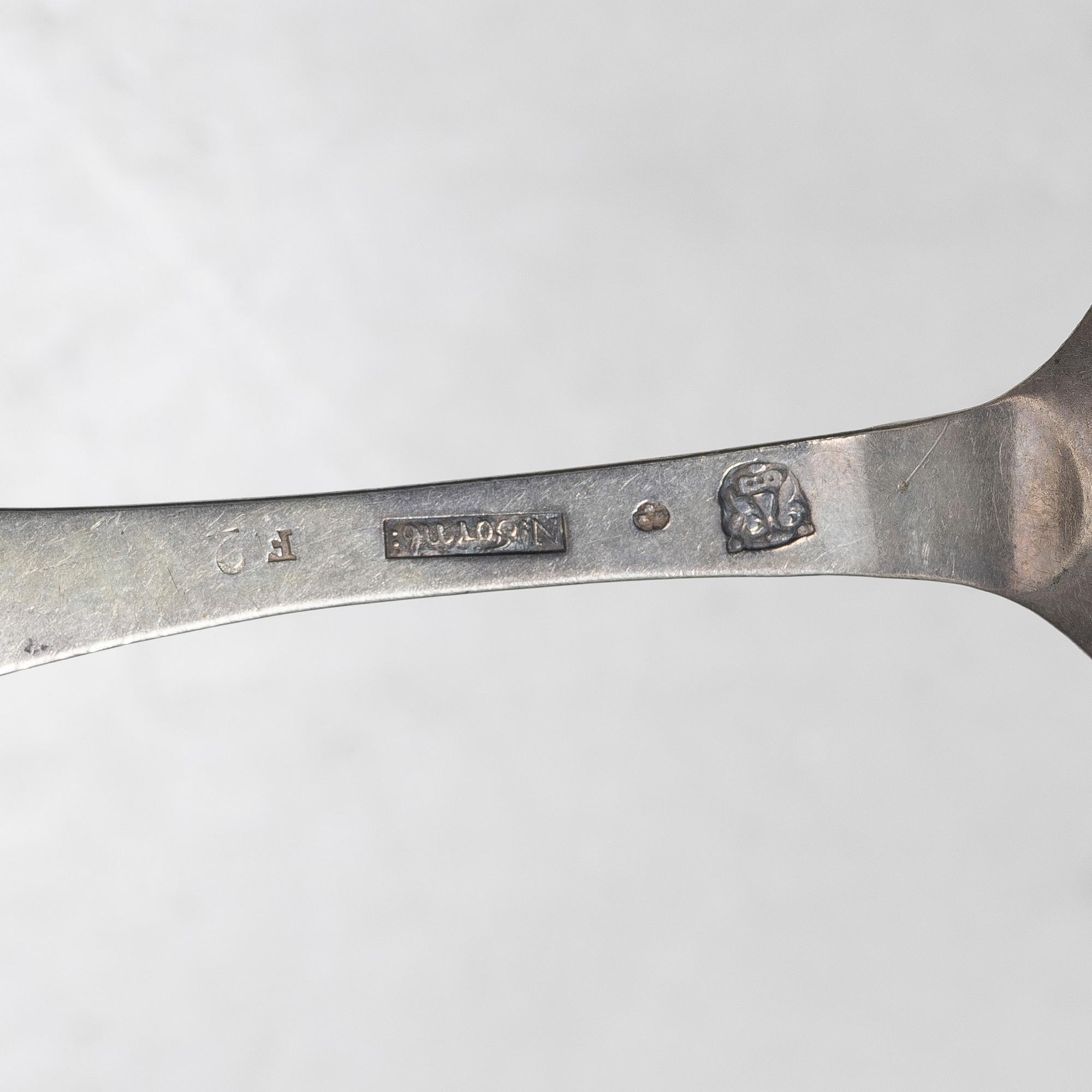 Seven silver spoons, including English and Swedish hallmarks.