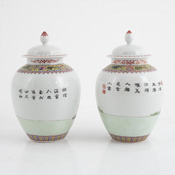 A pair of Chinese famille rose porcelain jars with covers, 20th century.