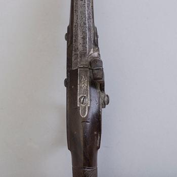 A 19th century percussion pistol.