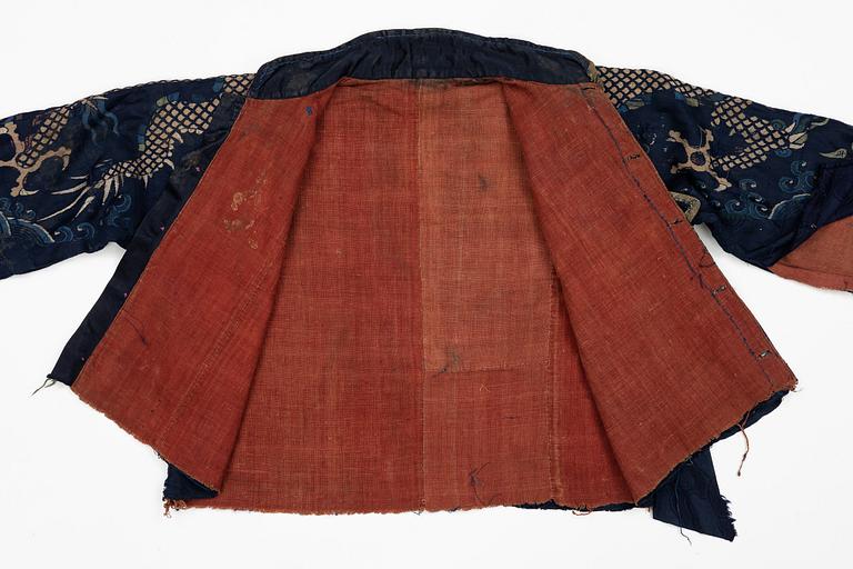 A rare fragment of a silk four clawed 'dragon' jacket, late Ming dynasty/early Qing dynasty.