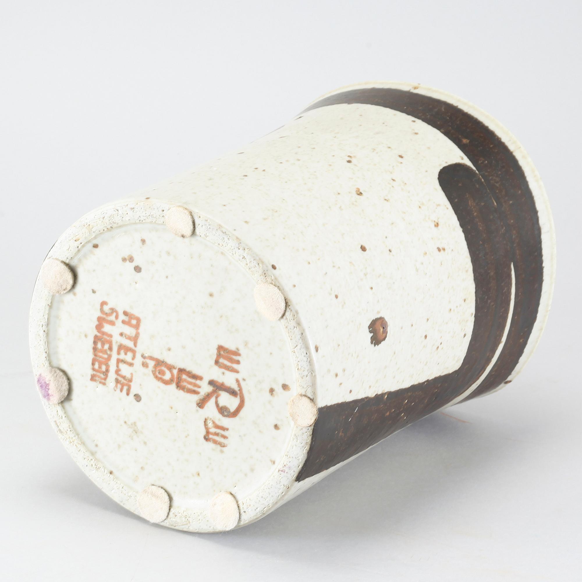 A stoneware flower pot by Inger Persson for Rörstrand Ateljé.
