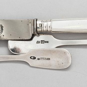 A Russian silver milk jug, and a silver fork, knife and spoon, Saint Petersburg 19th century.