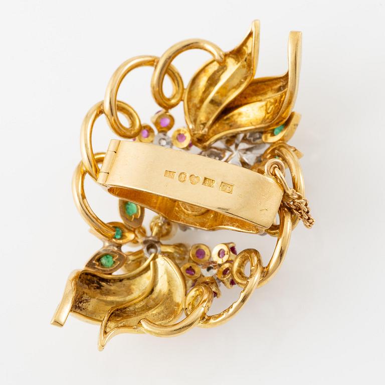 A Strömdahls bracelet/pendant combination in 18K gold with rubies, emeralds, pearls and diamonds.