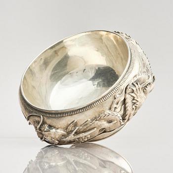 A Chinese double walled 'dragon' silver bowl, Shanghai, around 1900.