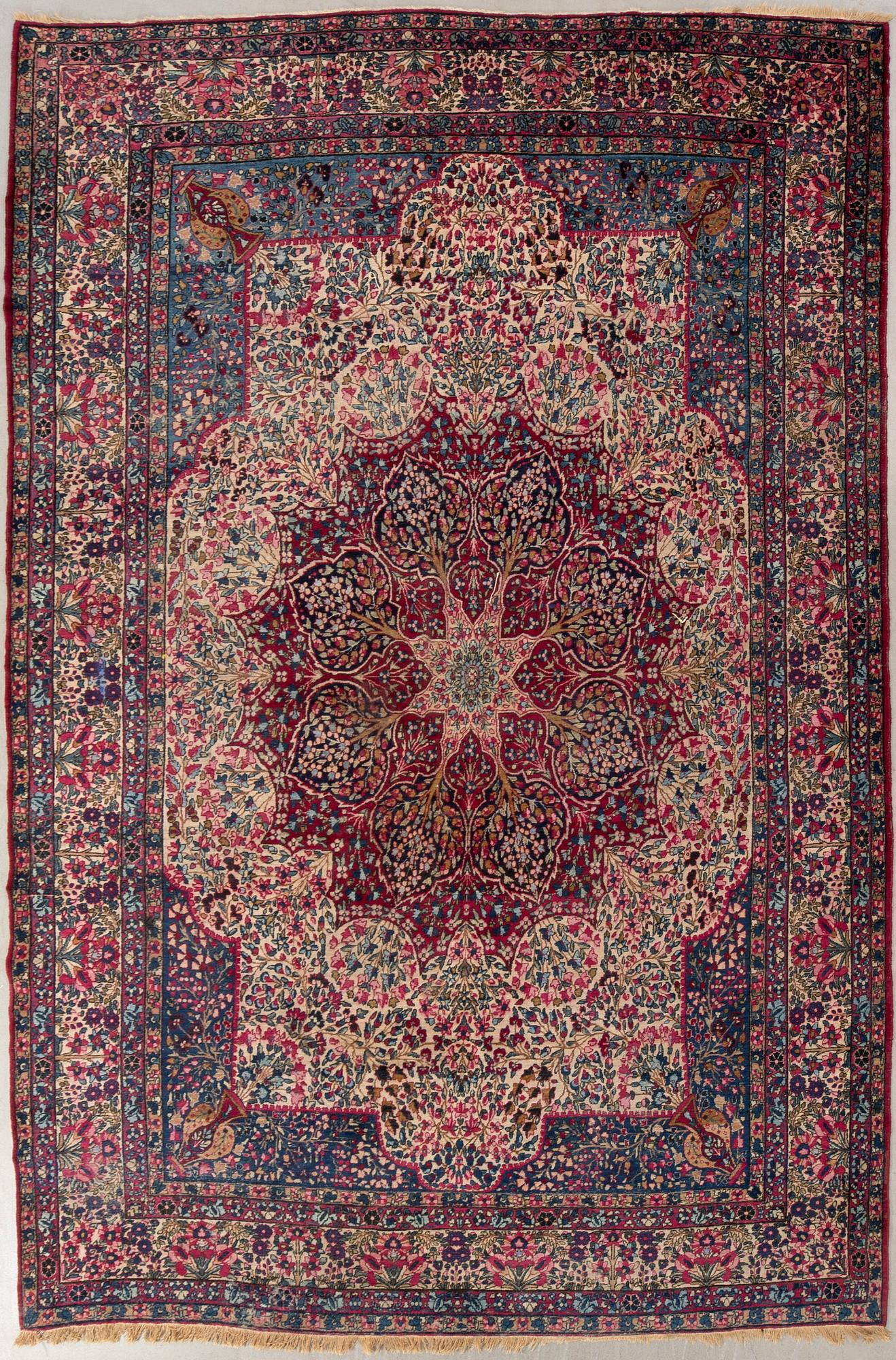 A semi-antique Kirman carpet, c. 396 x 261 cm.