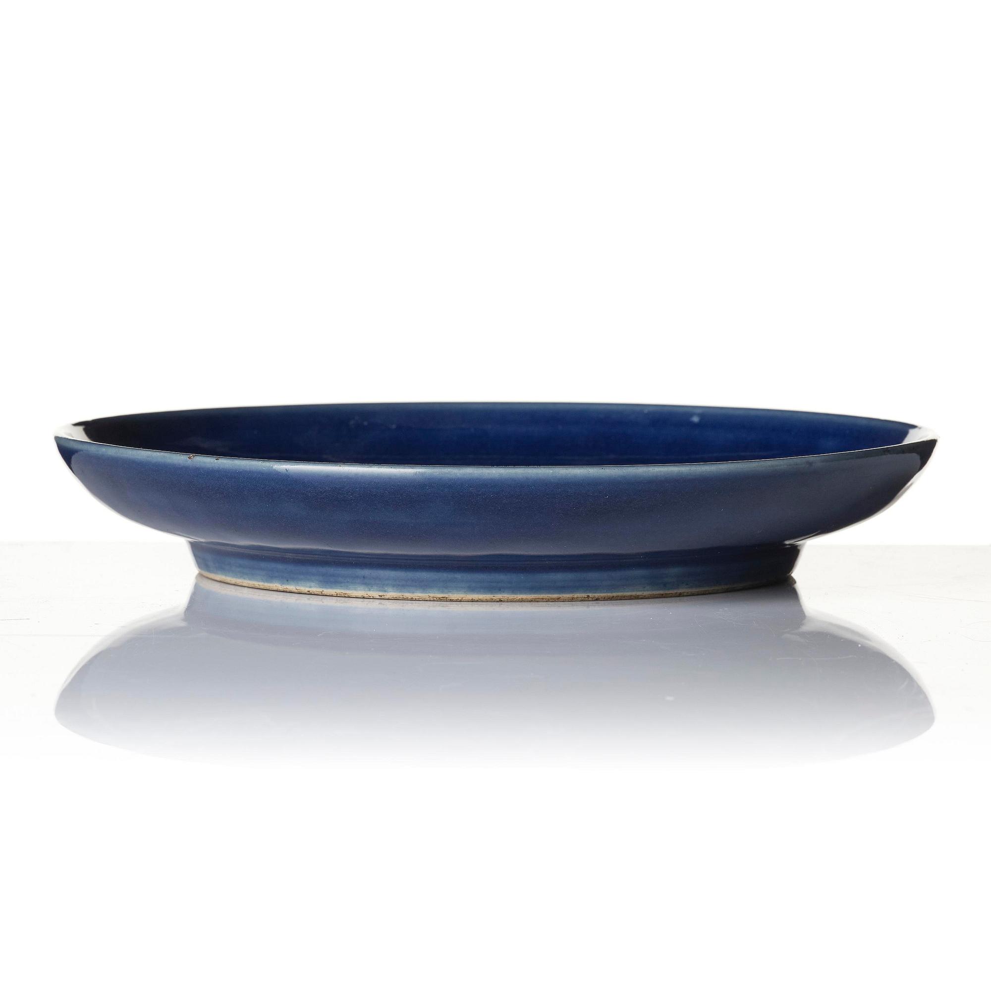 A blue glazed dish, Qing dynasty with an apocryphal four character mark of Chenghua.