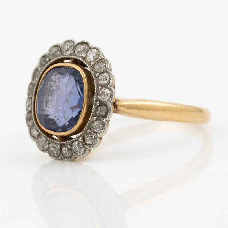 A ring in gold with a cushion-cut purple sapphire and old-cut diamonds, ca first half of the 20th century.