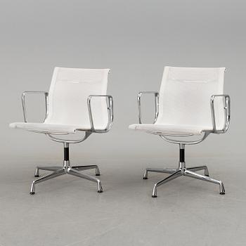 A pair of 'EA 108' desk chairs by Charles & Ray Eames for Vitra.