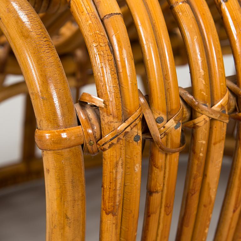A pair of mid-20th-century rattan armchairs.