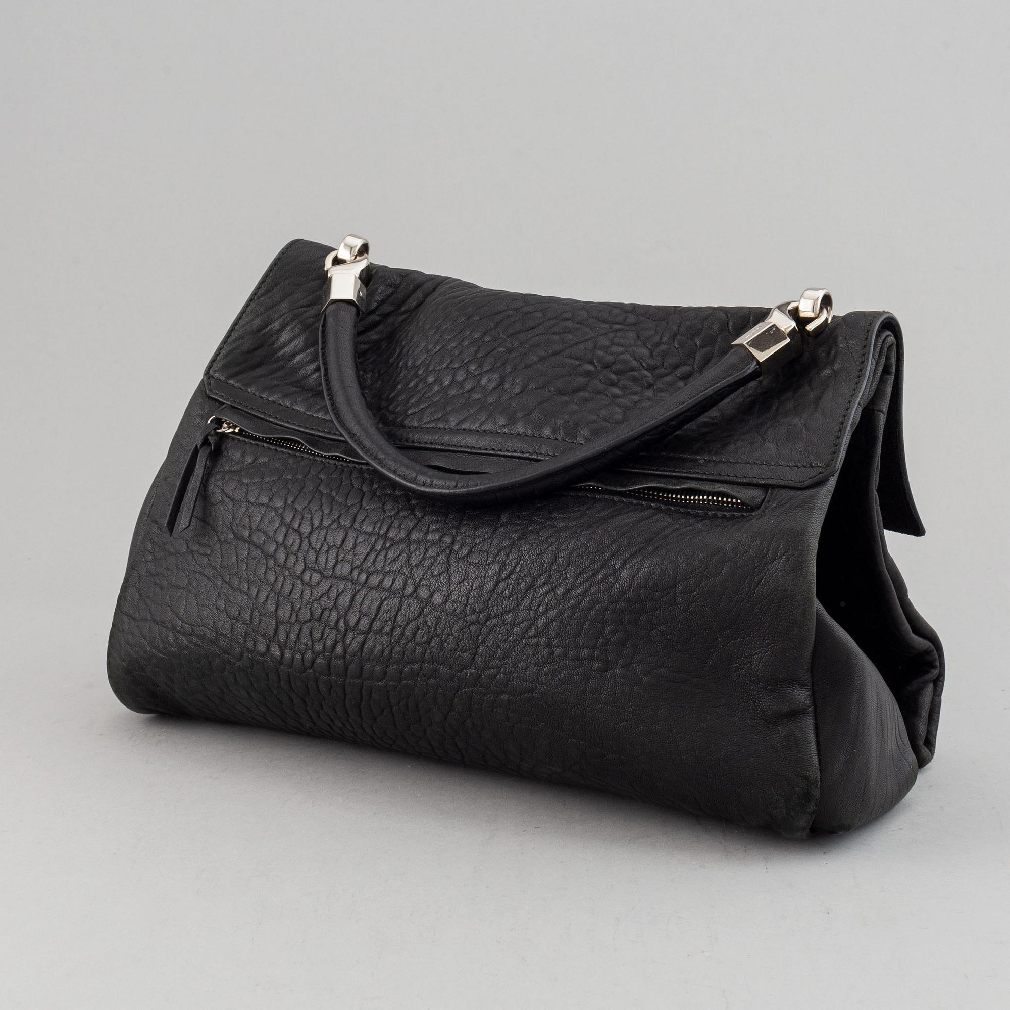Yves Saint Laurent, a black leather bag.