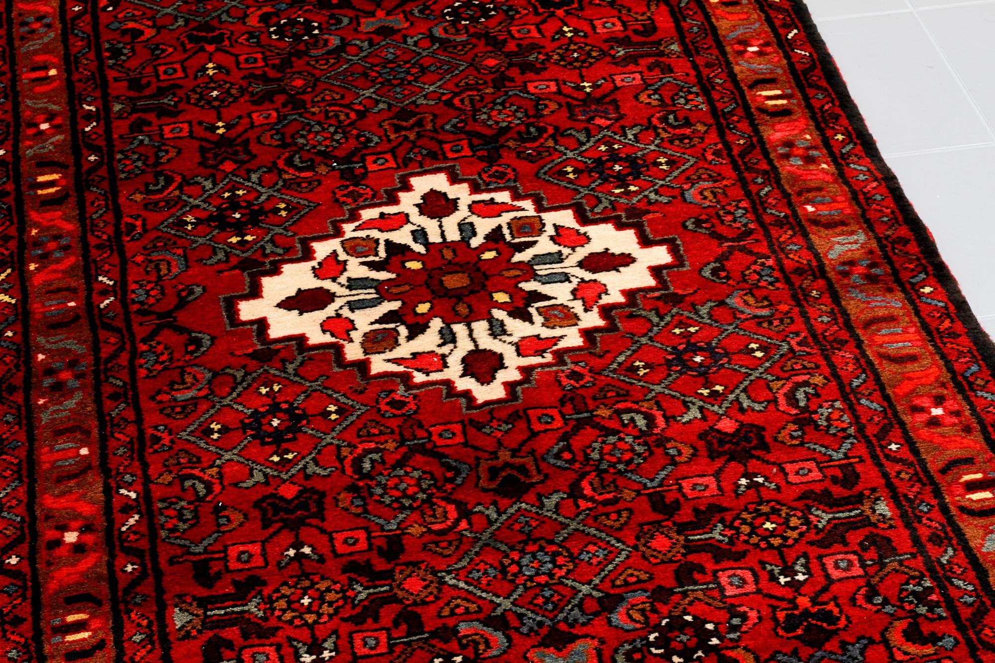 A Hosseinabad runner, 300 x 98 cm.