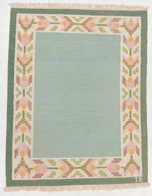 A flat weave carpet, signed TE, c. 224 x 126 cm.