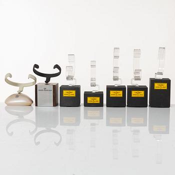 Clock stands, 7 pcs, Breitling, TAG Heuer and Girard-Perregaux.