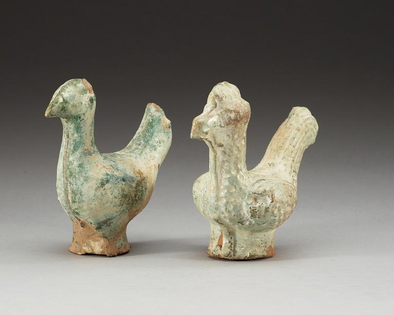 A set of two green glazed pottery models of a rooster and a hen, Han dynasty (206 BC- 220 AD).