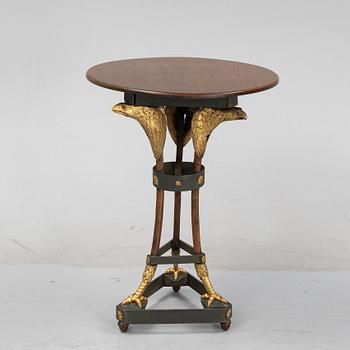 A presumably Russian giltwood and walnut Empire table, early 19th Century.