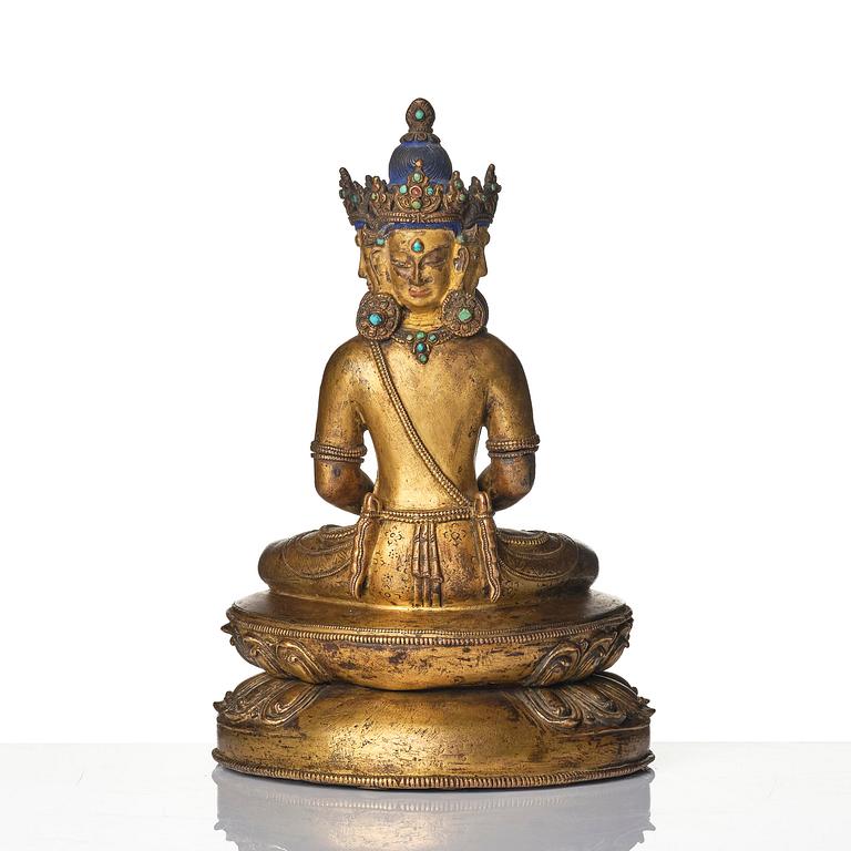 A Tibetan or Nepalese Gilt-Copper Alloy Figure of Sarvavid Vairocana, 15th century.