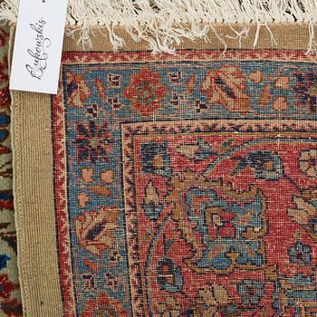 A CARPET, a semi-antique Tabriz probably, ca 393 x 284 cm.
