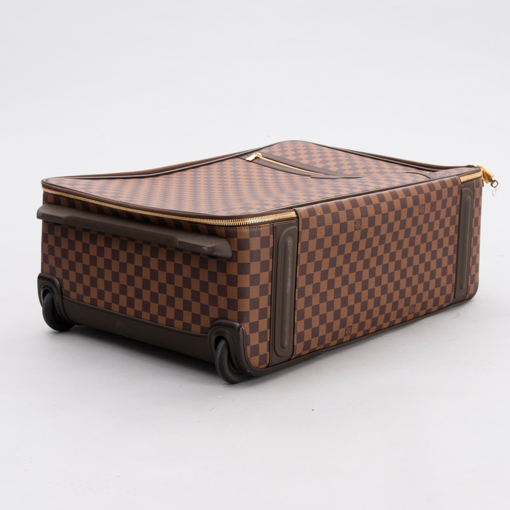 LOUIS VUITTON Damier Ebene Brown Pégase Suitcase with protective cover.
