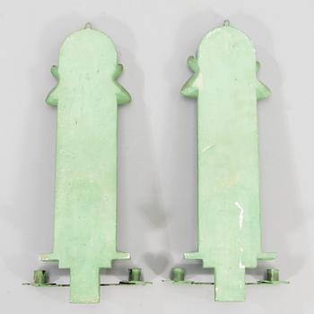 A pair of Art Deco wall sconces, patinated plaster and metal, A. E. Lindskog fecit MCMXXXX.