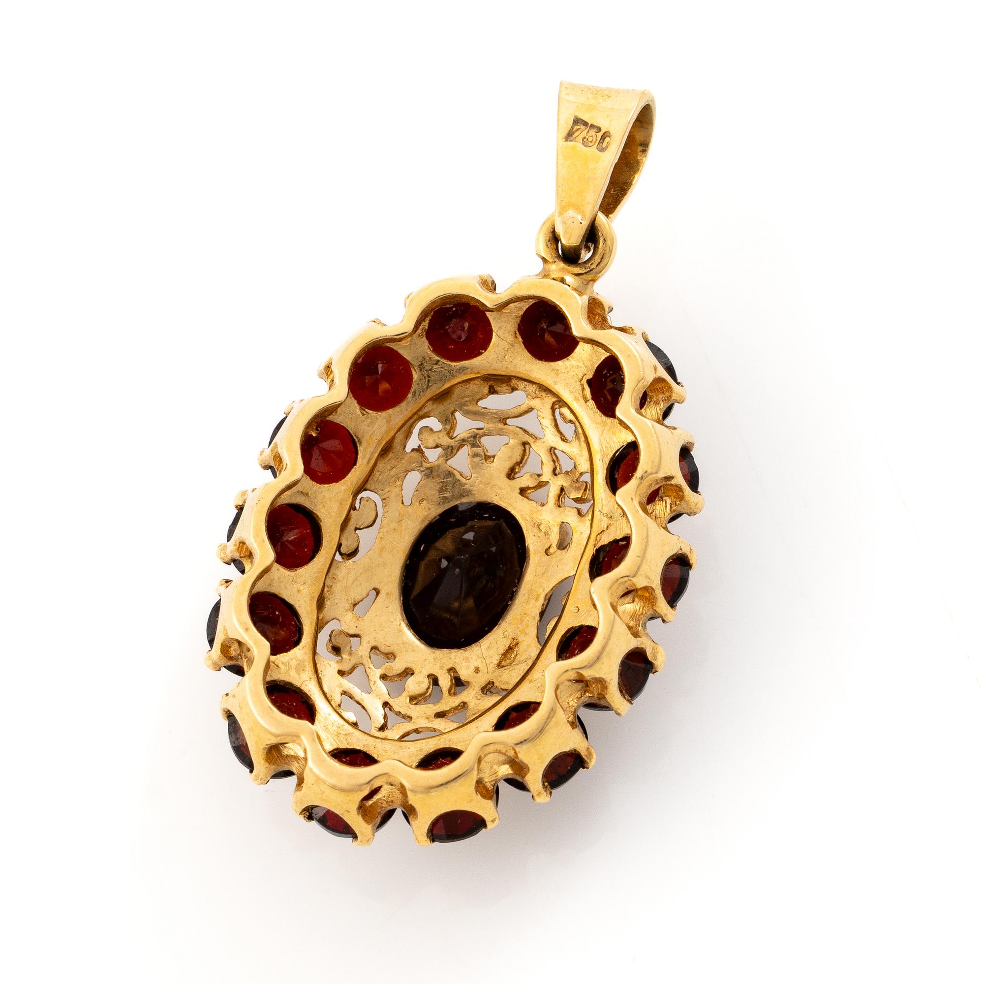 Pendant, 18K gold with garnets.