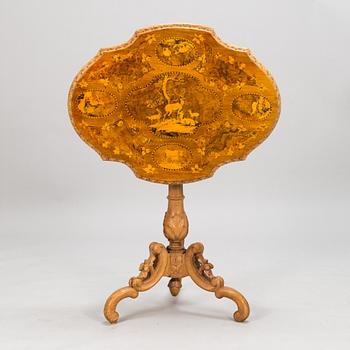 A Russian marquetry tilt-top table from the 1870s.