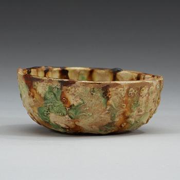 A sancai glazed pottery bowl, Tang dynasty (618-907).