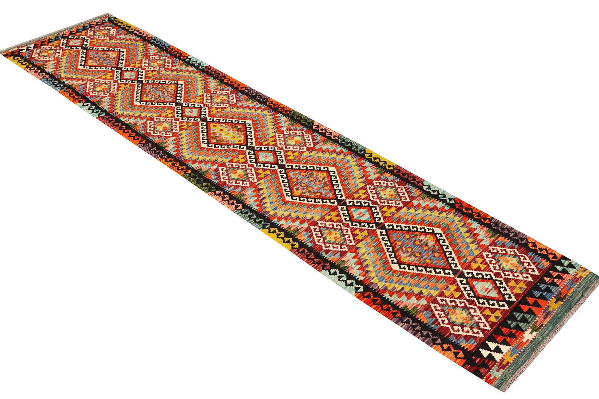 An Afghan Kelim runner, c. 384 x 83 cm.