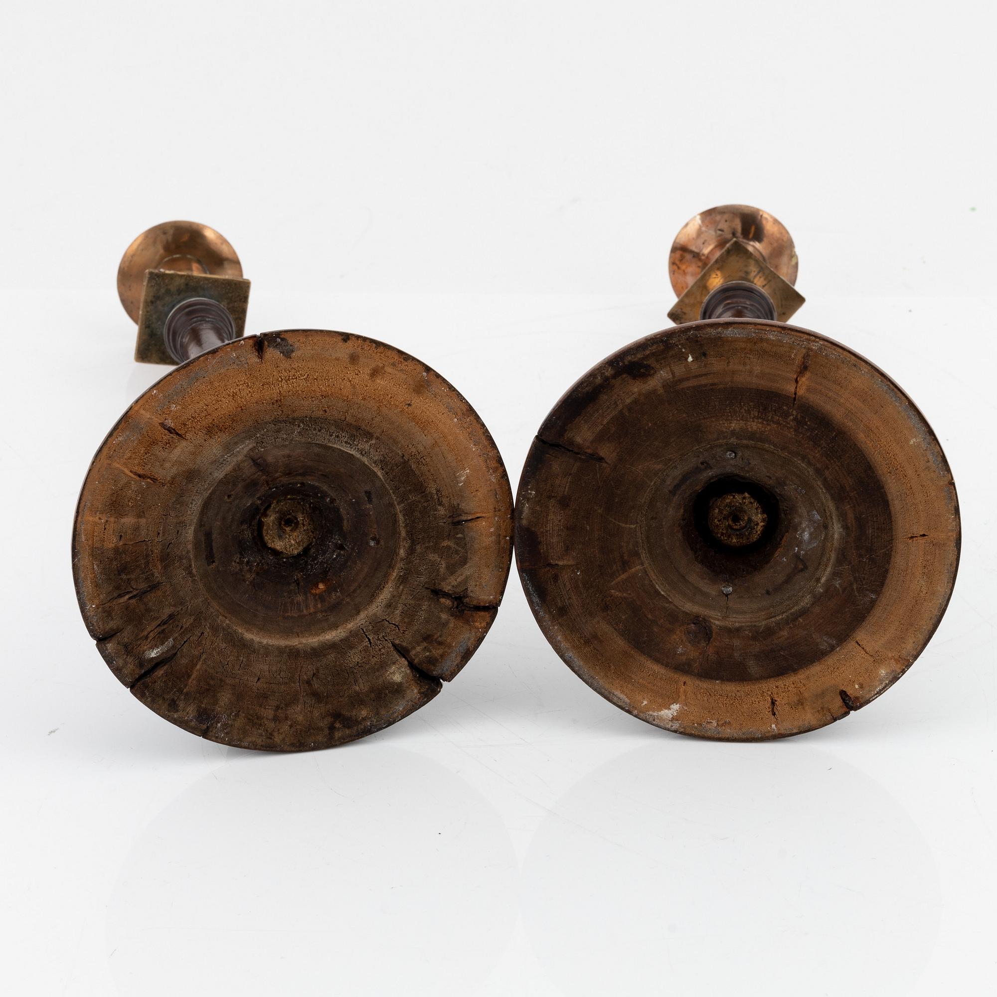 A pair of 19th century candlesticks in wood and brass and white metal.