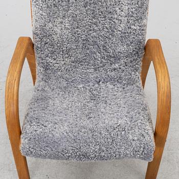 Jan Ekström, armchair with footstool "Gazelle", Conform, 21st century.