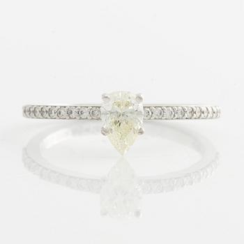 Ring with pear-shaped diamond.