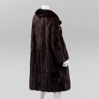 a mink coat by Johnssons Päls, Malmö, size app 40.