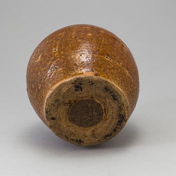 A south east asian pottery urn 18/19th century.