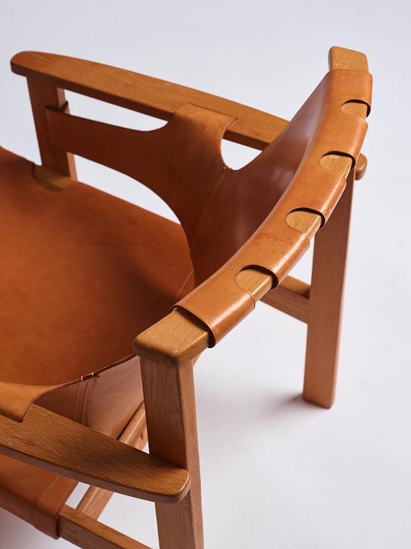 Carl-Axel Acking, an oak and brown natural leather 'Trienna' chair, Nordiska Kompaniet, Sweden.