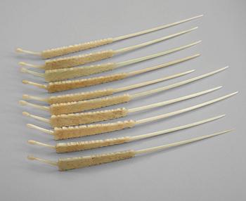 A set of ten carved pale celadon nephrite hairpins, late Qing dynasty (1644-1912).