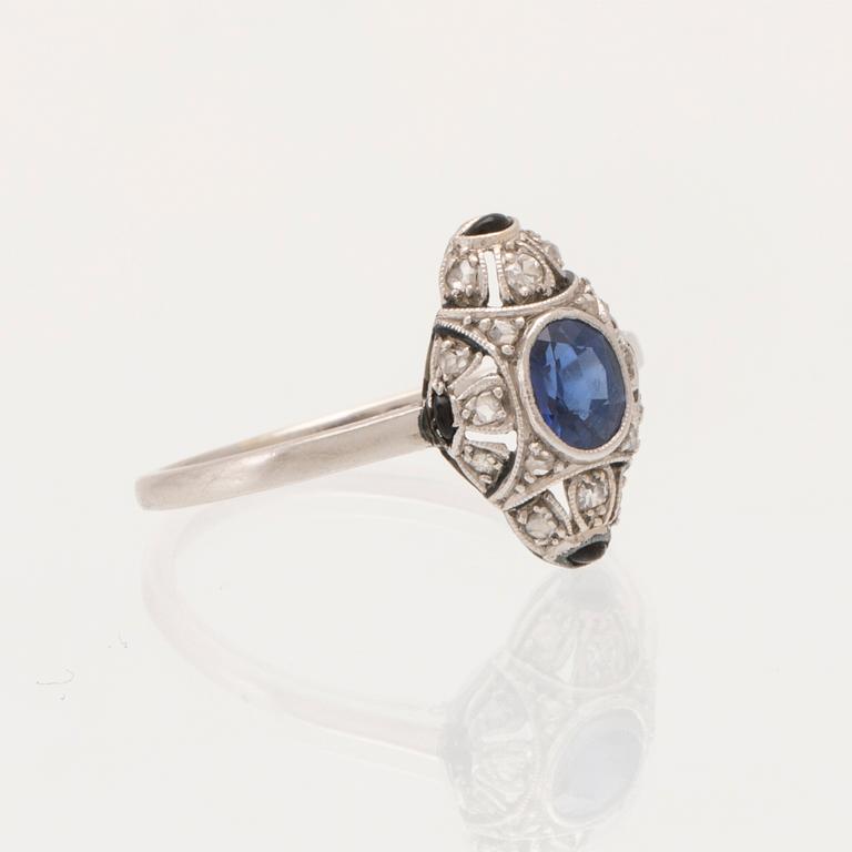 Art Deco platinum ring with an oval faceted sapphire and old-cut and rose-cut diamonds.