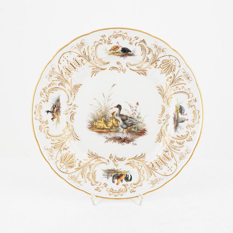 A set of five Meissen porcelain games plates, late 19th to early 20th century.