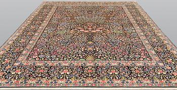 A Kirman Laver carpet, 'Millefleur', approx. 388 x 300 cm.