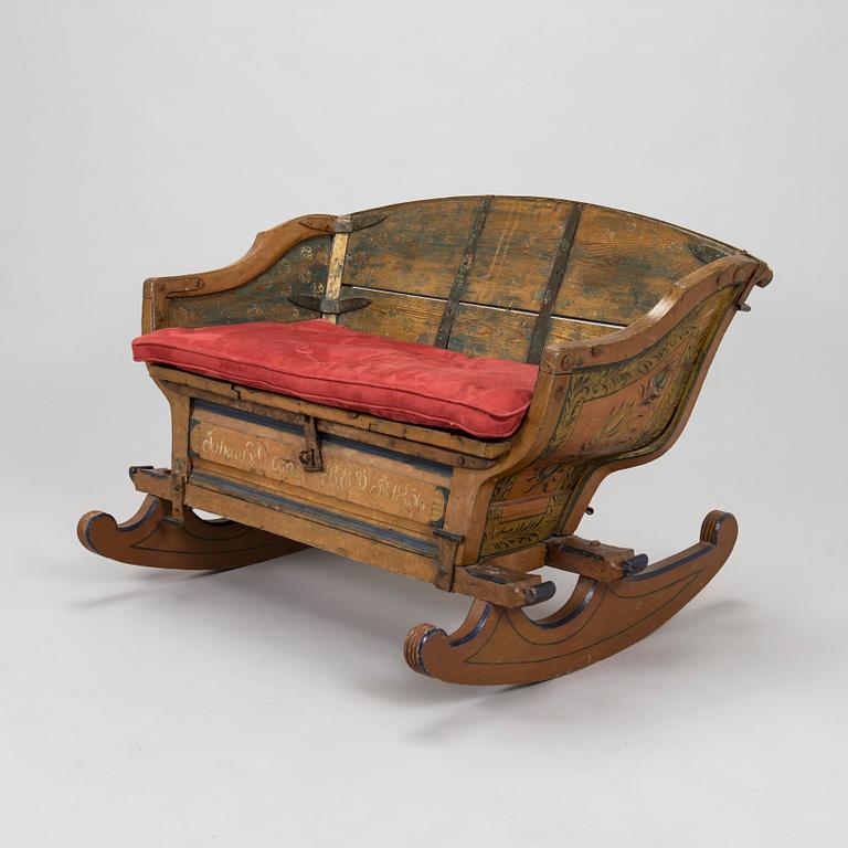 A 19th-century wooden sleigh.