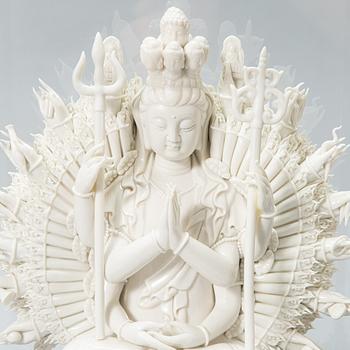 An oriental Buddha statue in porcelain.