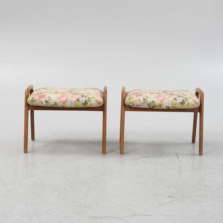 A pair of ottomans, 20th century.