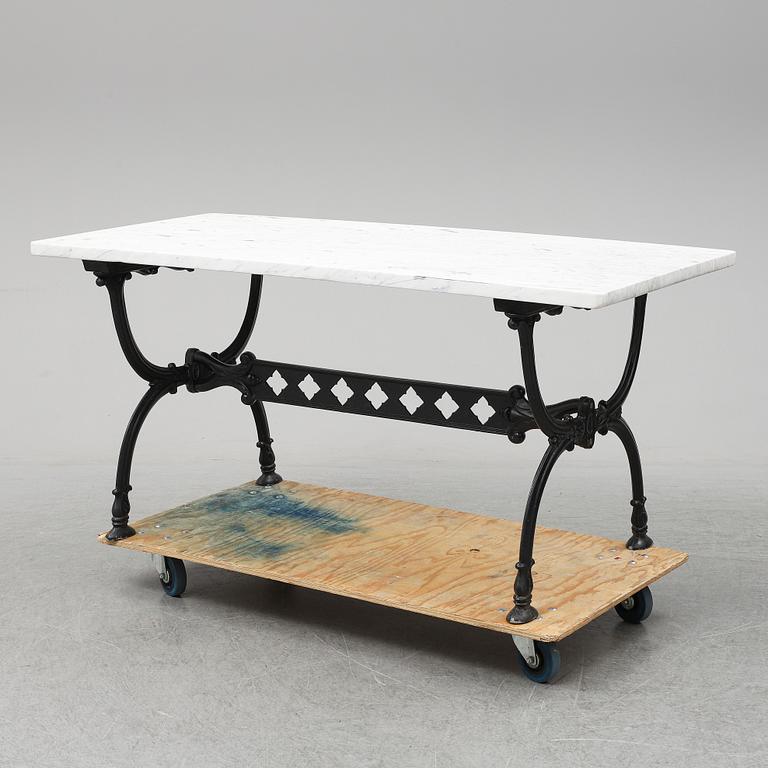 An end of the 20th Century aluminum and marble garden table.