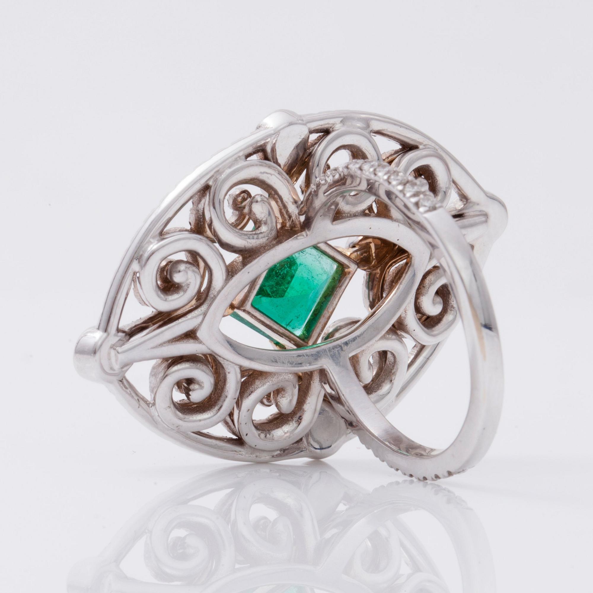 An octagonal/step-cut emerald, 1.65 cts, and diamond 1.25 cts (pavé-set) ring.