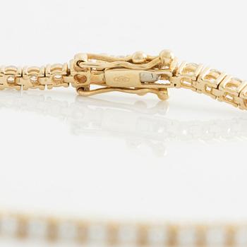 Tennis bracelet, 14K gold with brilliant-cut diamonds.