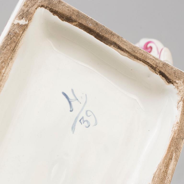 A PAIR OF FRENCH FAYENCE BOOK ENDS, 20th century.